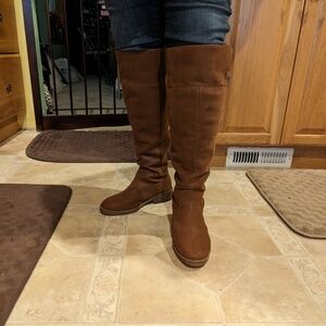 A pair of knee high boots.